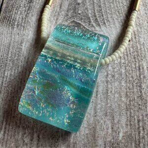 22-inch necklace featuring a stunning aqua dichroic glass pendant
